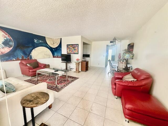 4014 Newcastle A Boca Raton, FL 33434 - Photo 2 of 33 a living room with furniture a rug and gym equipment