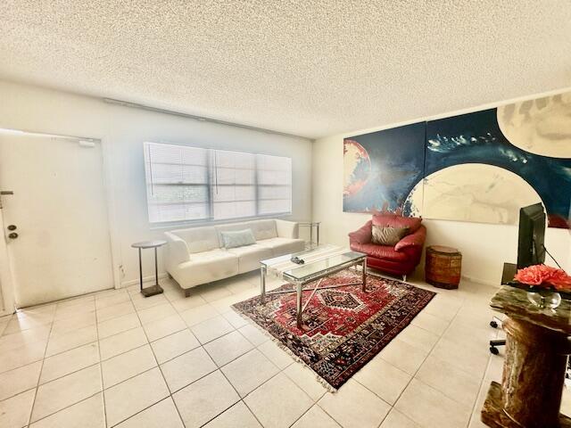 4014 Newcastle A Boca Raton, FL 33434 - Photo 3 of 33 a living room with furniture and a table