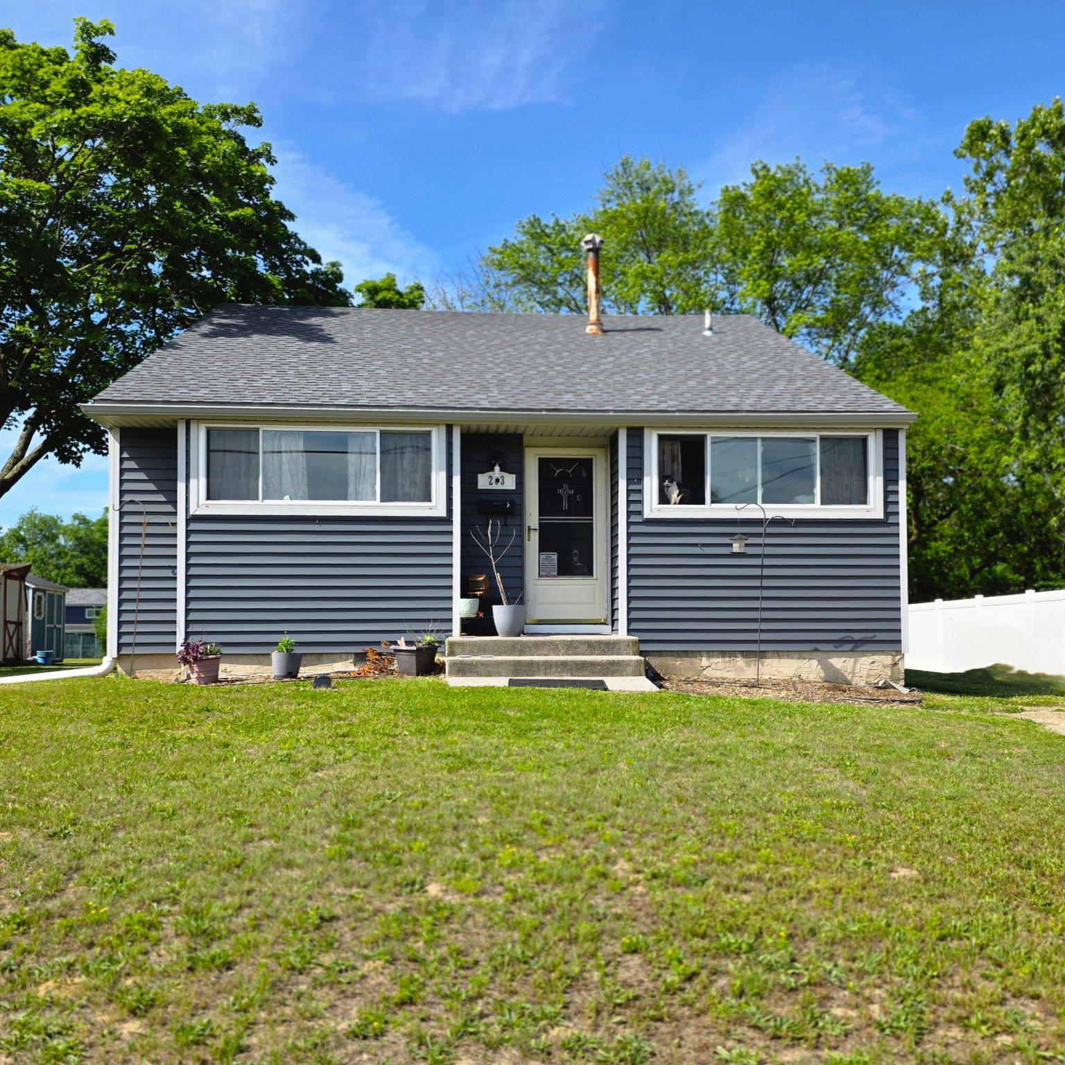 Charming home with NEWER siding, windows, roof...