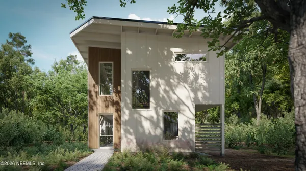 a view of a house with a tree