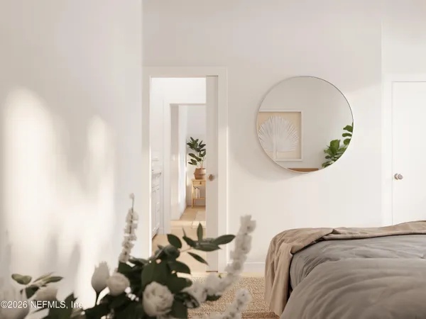 a bed room with a bed and a mirror