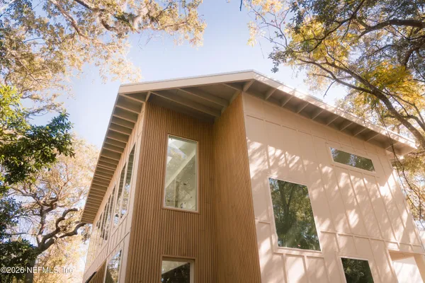 a view of a house with a tree