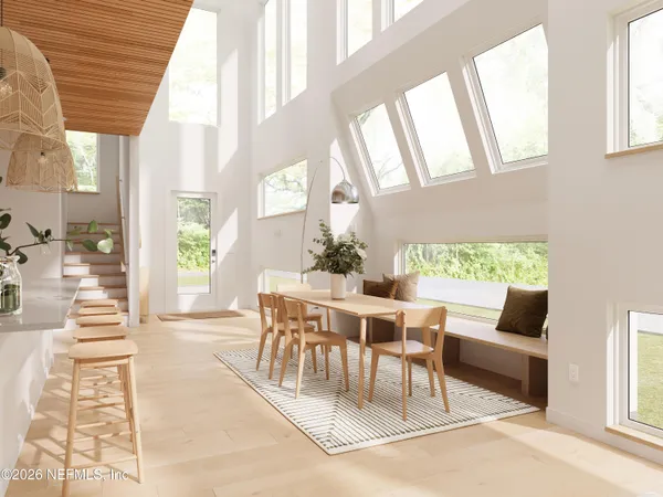 a dining room with furniture and wooden floor