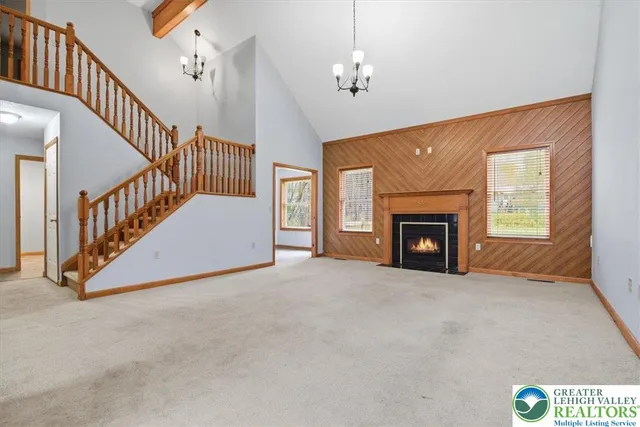 a view of a kitchen with a refrigerator a microwave and a sink