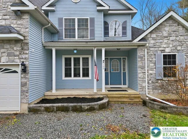 a view of empty room with a fireplace