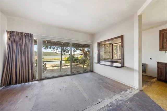 a kitchen with sink window and cabinets