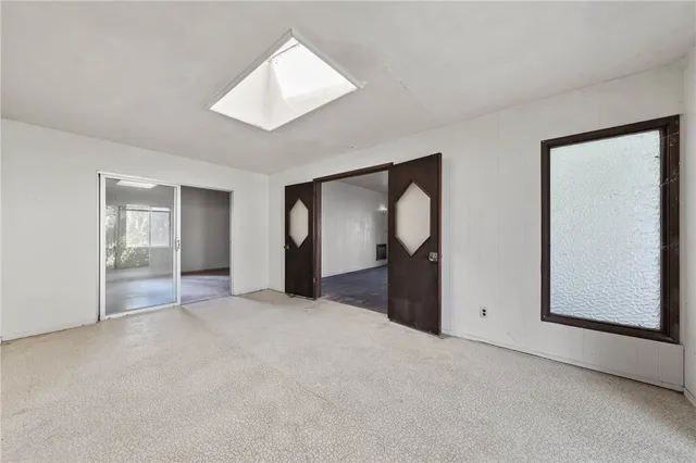 a view of a living room with windows