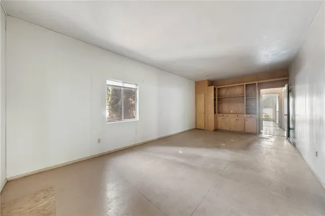 a view of an empty room and window