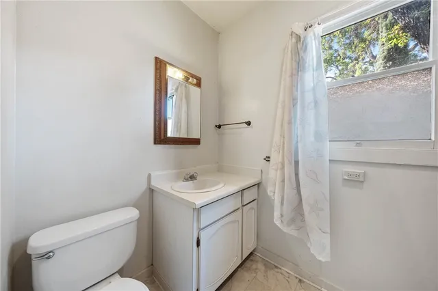 a bathroom with a glass shower door