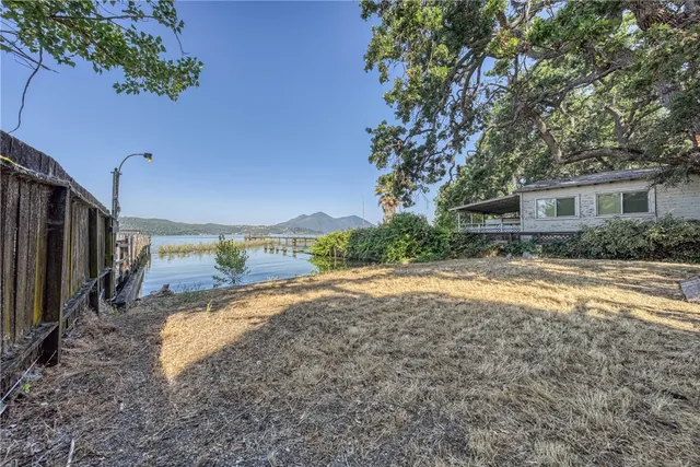 a view of yard with swimming pool and green space