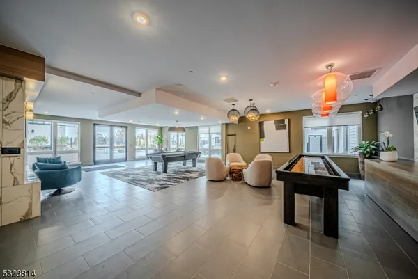 a lobby with furniture and rug