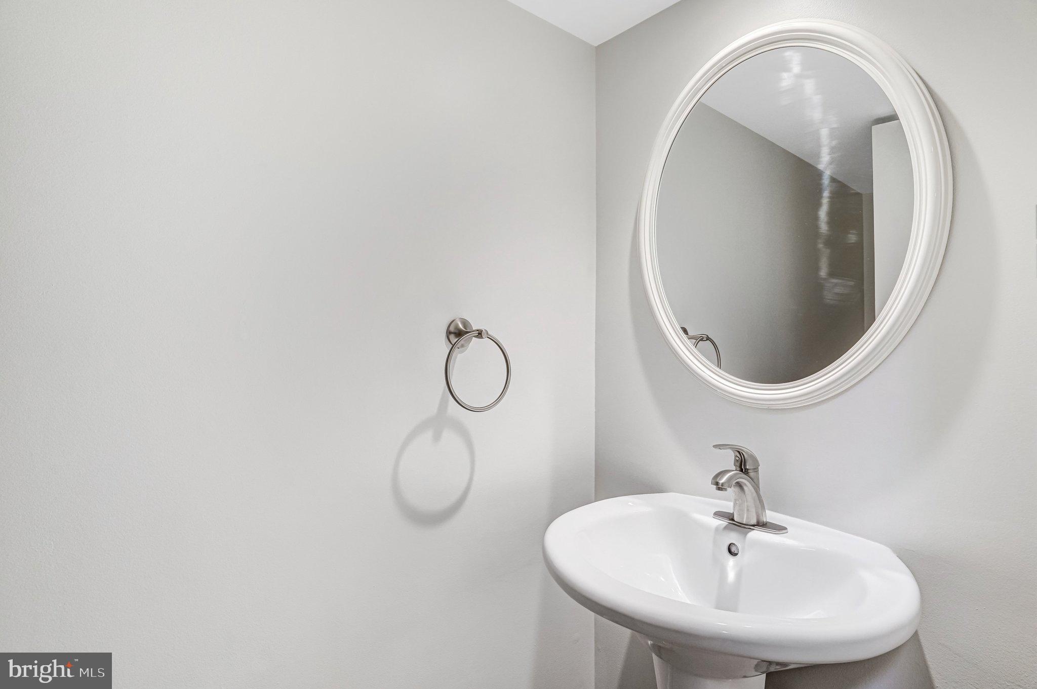 9752 Cardinal Road Fairfax, VA 22030 - Photo 15 of 37 a bathroom with a sink and a mirror