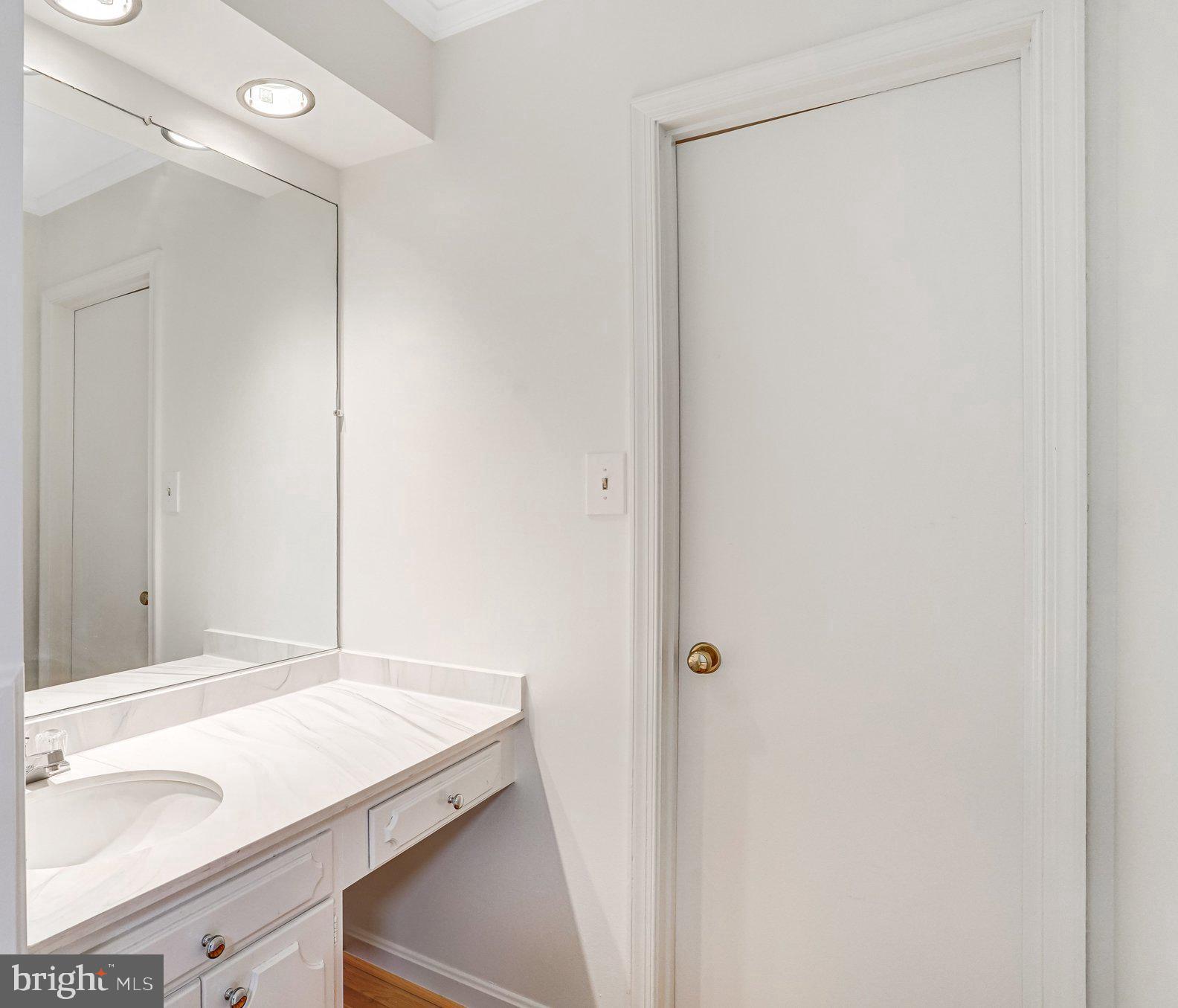 9752 Cardinal Road Fairfax, VA 22030 - Photo 18 of 37 a bathroom with a sink and a mirror