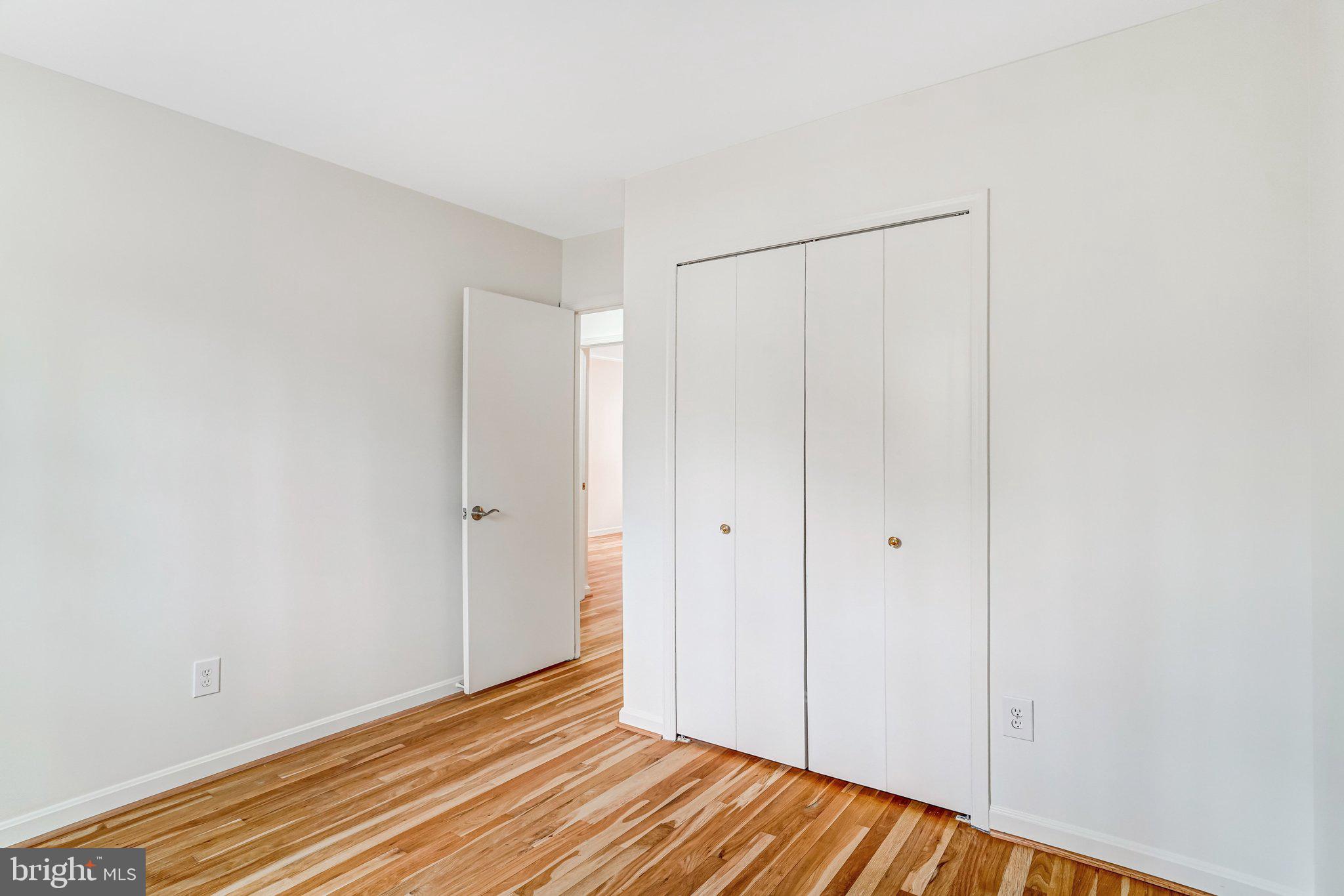 9752 Cardinal Road Fairfax, VA 22030 - Photo 23 of 37 a view of an empty room with wooden floor