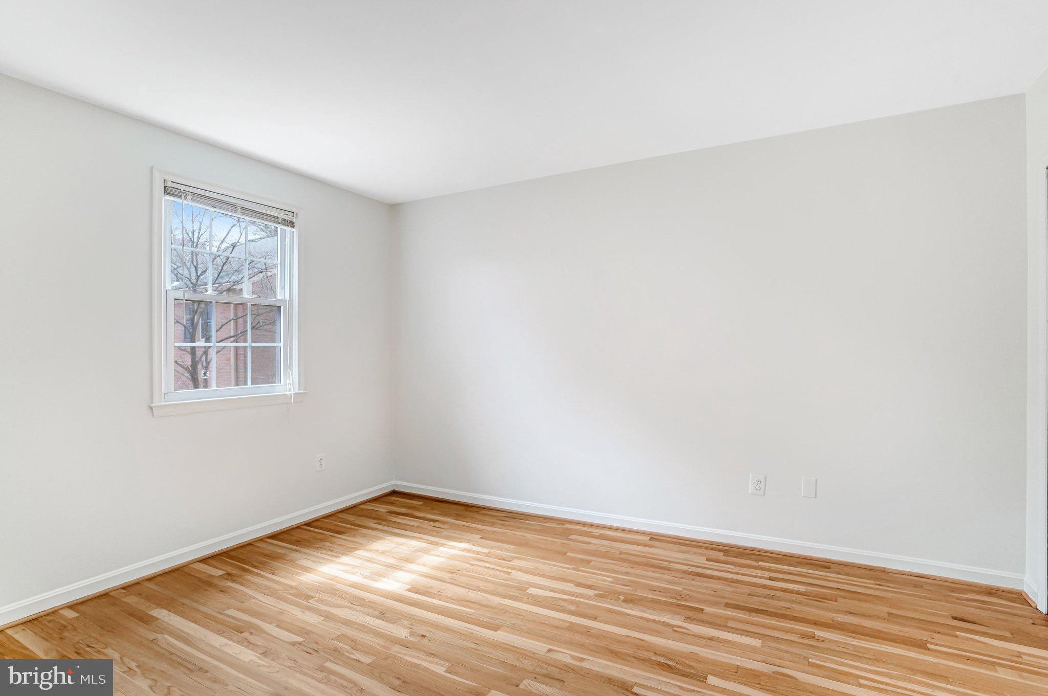 9752 Cardinal Road Fairfax, VA 22030 - Photo 26 of 37 a view of empty room with wooden floor and fan