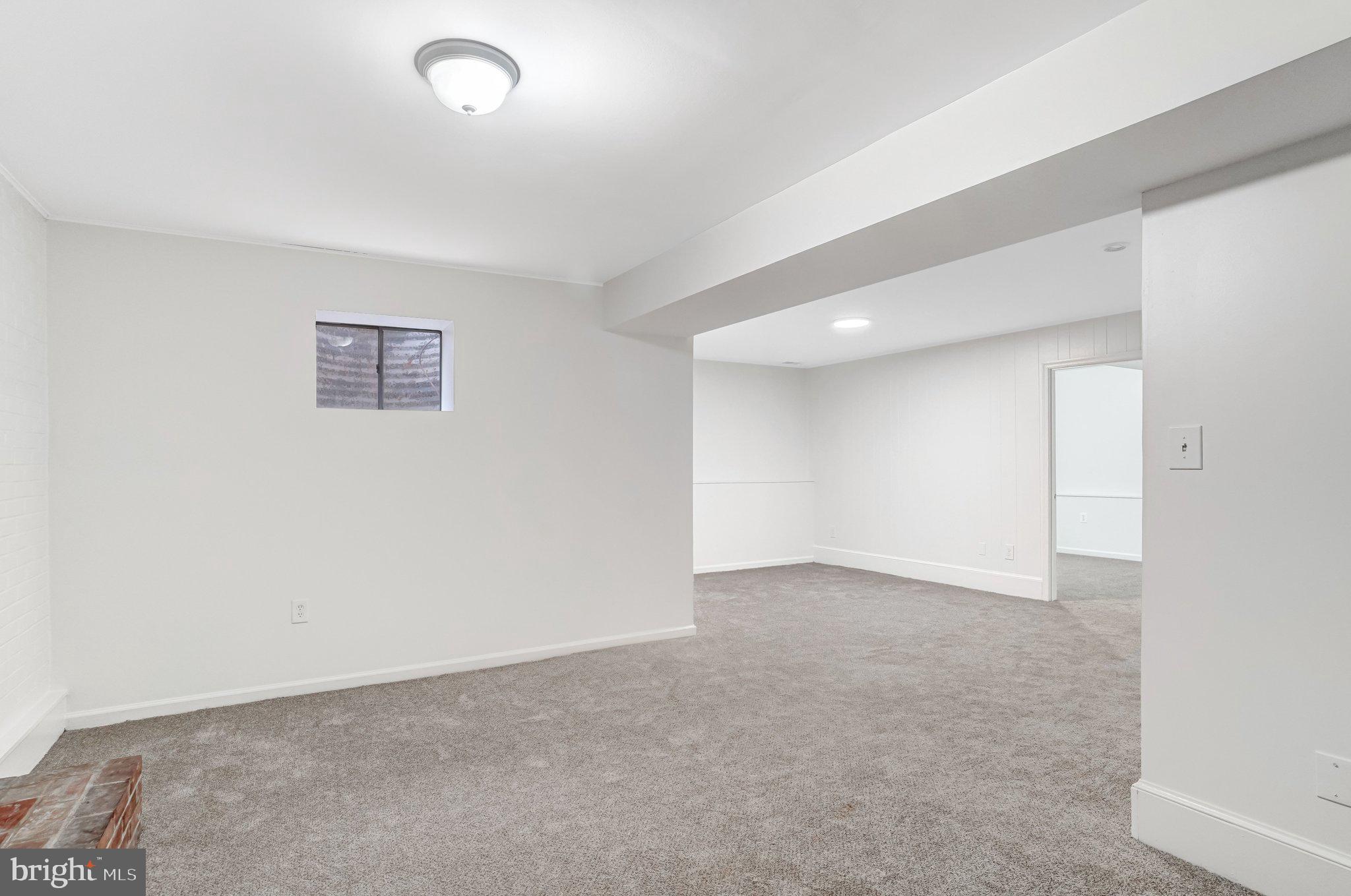 9752 Cardinal Road Fairfax, VA 22030 - Photo 30 of 37 an empty room with a projector and a window