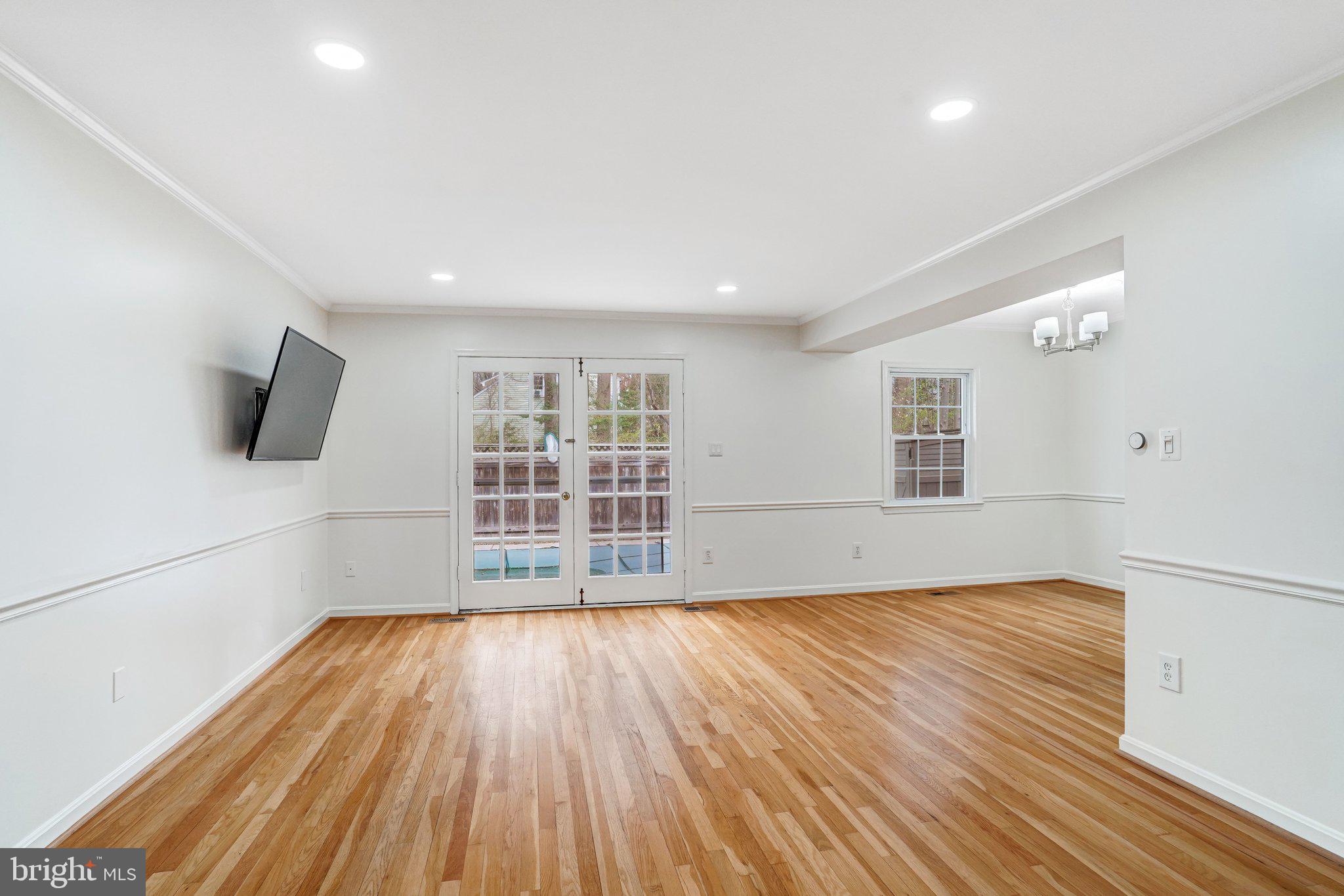 9752 Cardinal Road Fairfax, VA 22030 - Photo 10 of 37 a view of empty room with wooden floor and fan