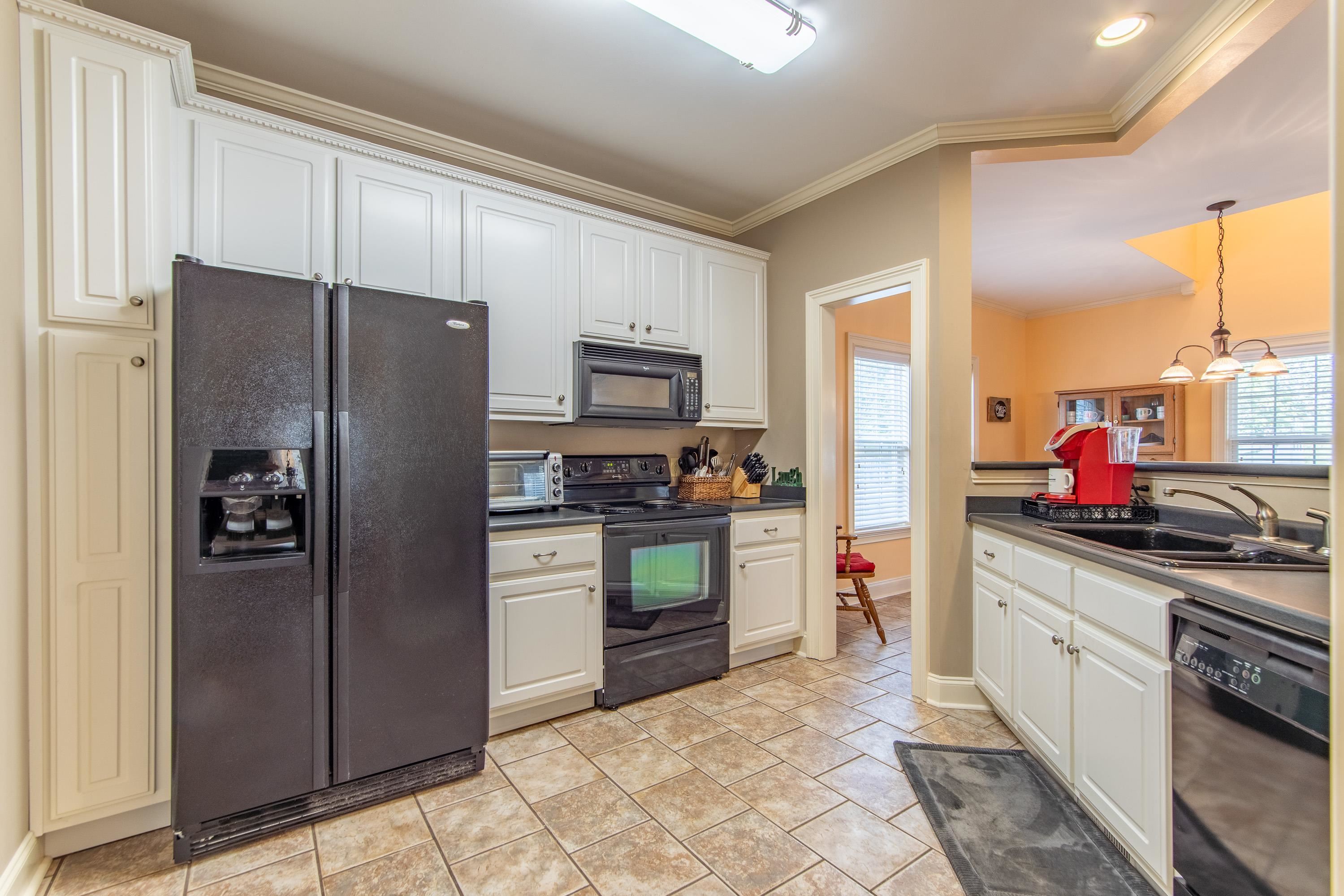 18 Mountain View Iuka, MS 38852 - Photo 18 of 40 a kitchen with a refrigerator and a sink