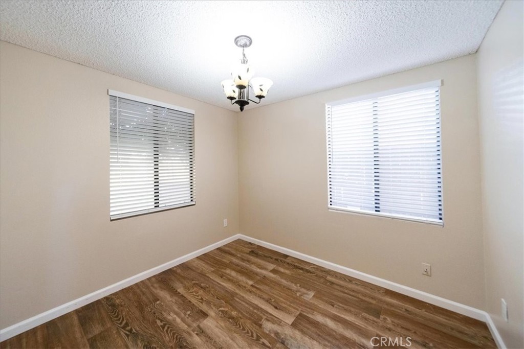 39739 Old Carriage Road Murrieta, CA 92563 - Photo 15 of 31 a view of a room with a ceiling fan and a window