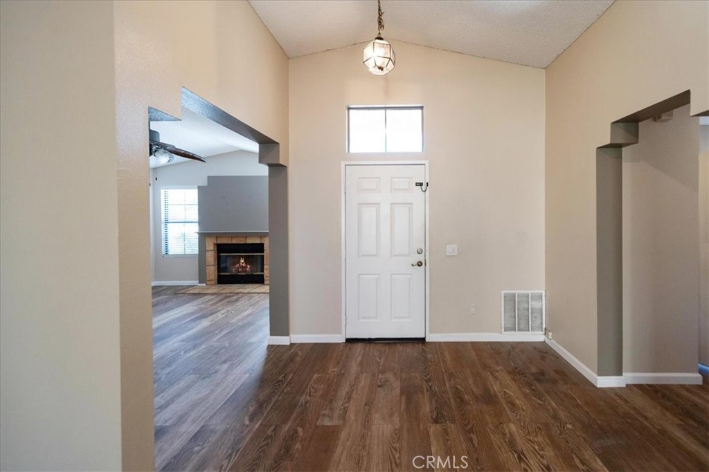 39739 Old Carriage Road Murrieta, CA 92563 - Photo 4 of 31 wooden floor in an empty room with a window