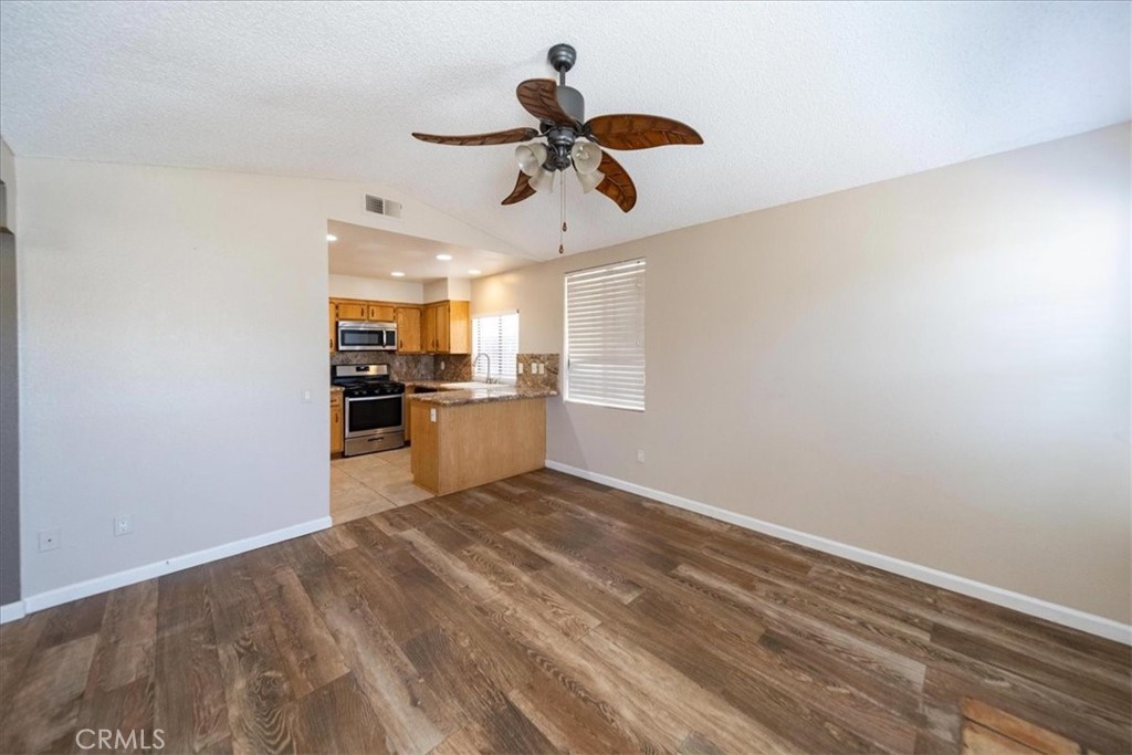 39739 Old Carriage Road Murrieta, CA 92563 - Photo 8 of 31 a view of a kitchen with a sink and refrigerator