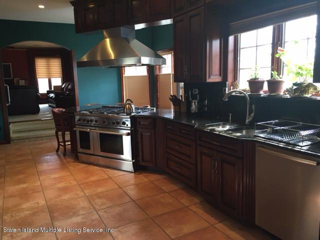 93 Romer Road Staten Island, NY 10304 - Photo 4 of 15 93 Romer Kitchen with title floor