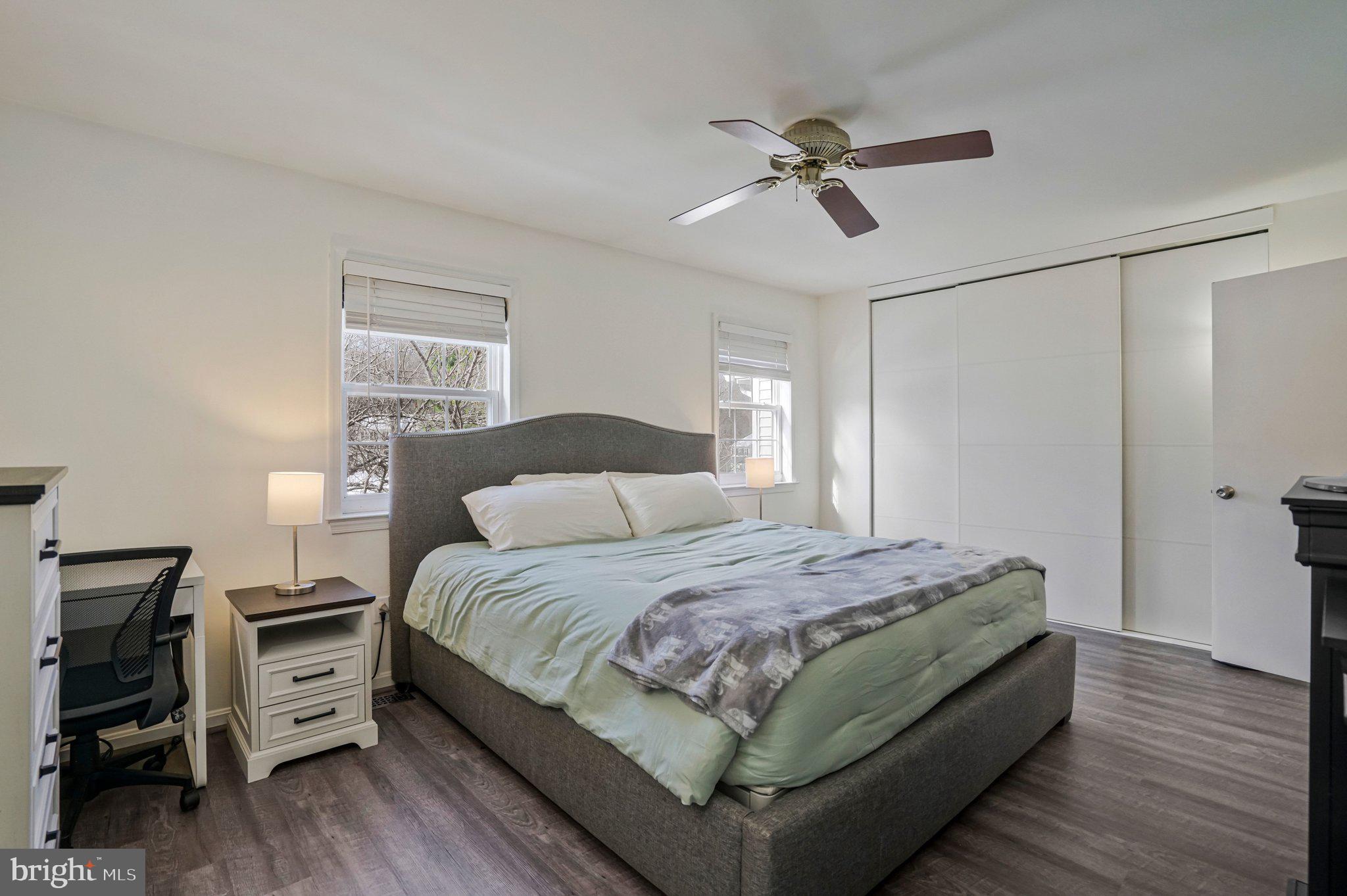 6064 Old Landing Way Burke, VA 22015 - Photo 18 of 38 a bedroom with a bed and a chandelier