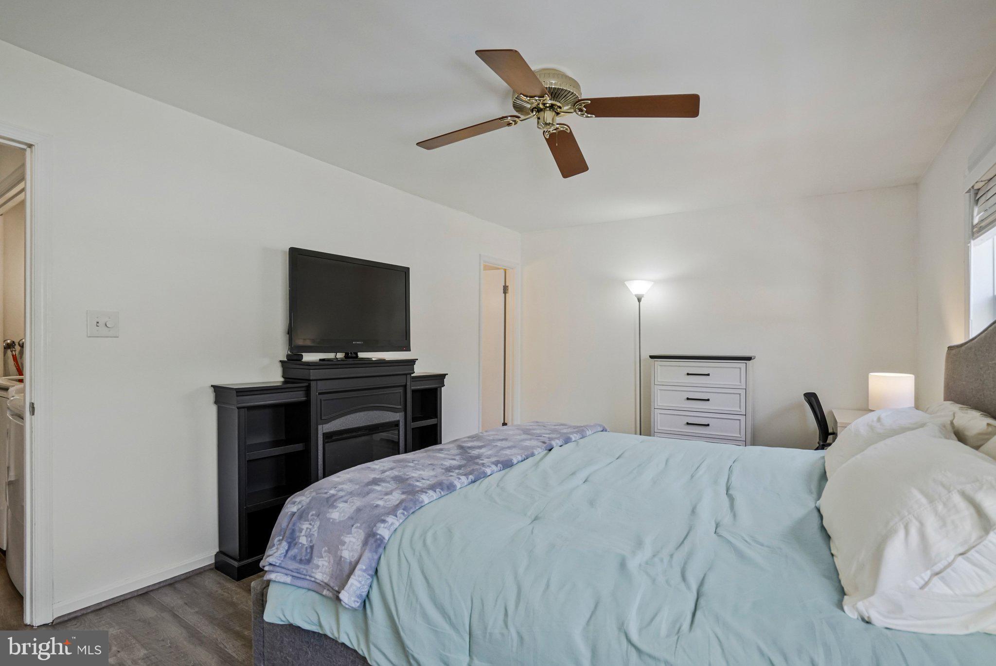 6064 Old Landing Way Burke, VA 22015 - Photo 20 of 38 a bedroom with a bed and a television