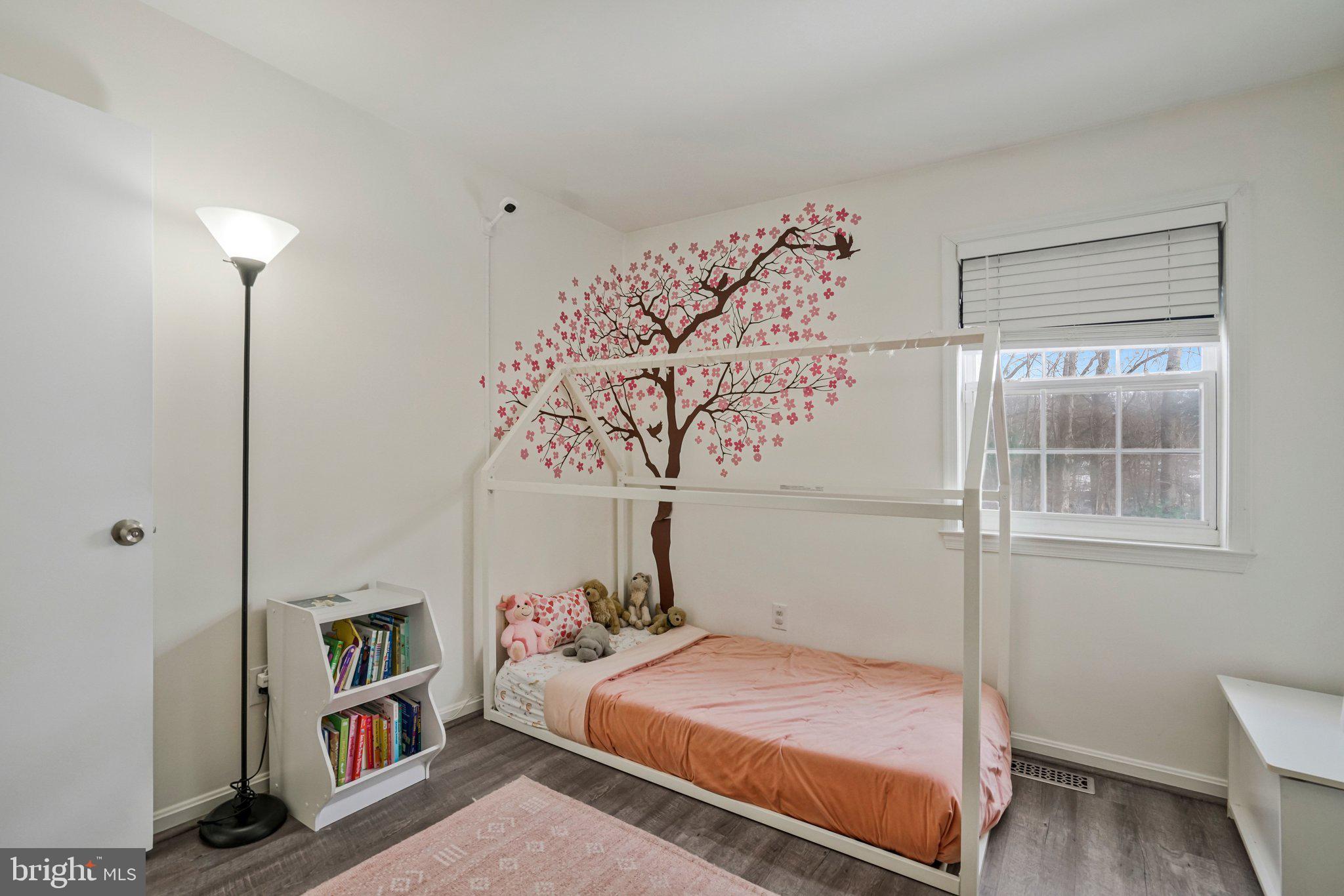 6064 Old Landing Way Burke, VA 22015 - Photo 27 of 38 a bedroom with a bed and a window