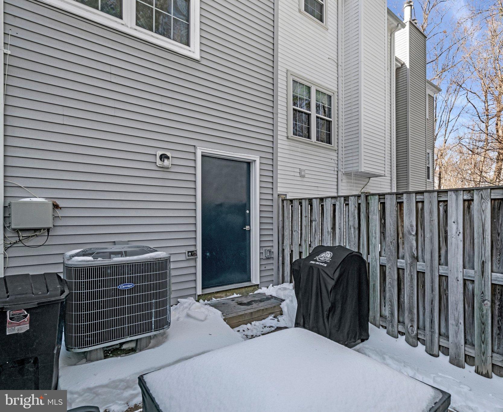 6064 Old Landing Way Burke, VA 22015 - Photo 30 of 38 a view of a patio with a table and chairs and wooden floor