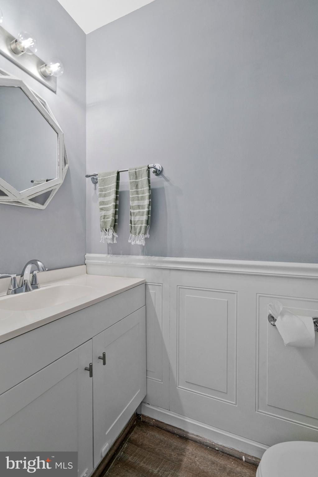 6064 Old Landing Way Burke, VA 22015 - Photo 7 of 38 a bathroom with a sink and a mirror