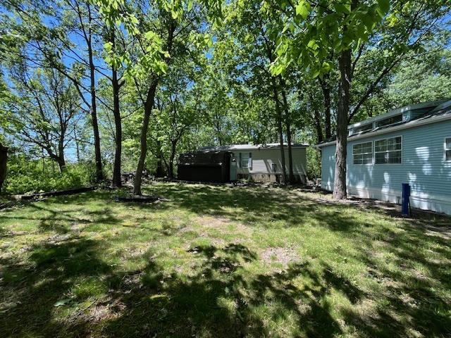 2795 East 28th Road Marseilles, IL 61341 - Photo 5 of 59 a view of a backyard with large trees