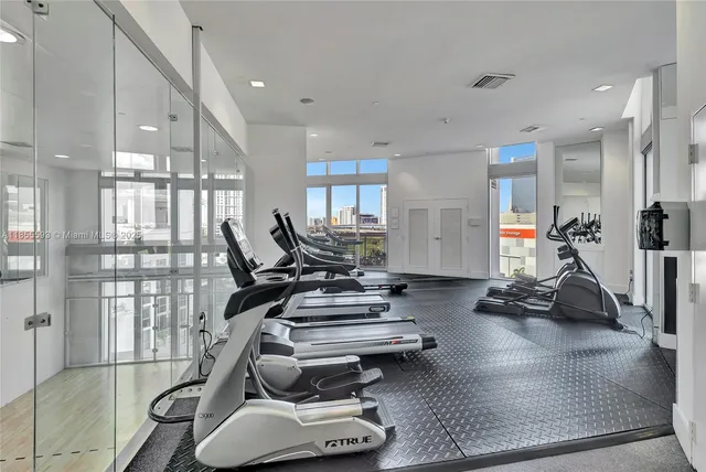 a room with lots of counter and chairs