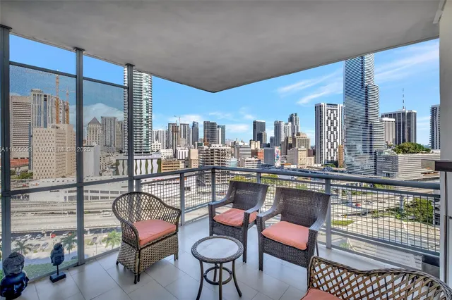 a room with furniture and a floor to ceiling window