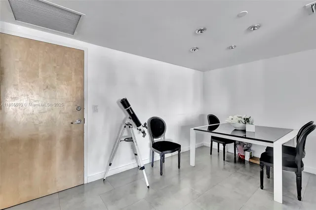 a view of a hallway with seating area