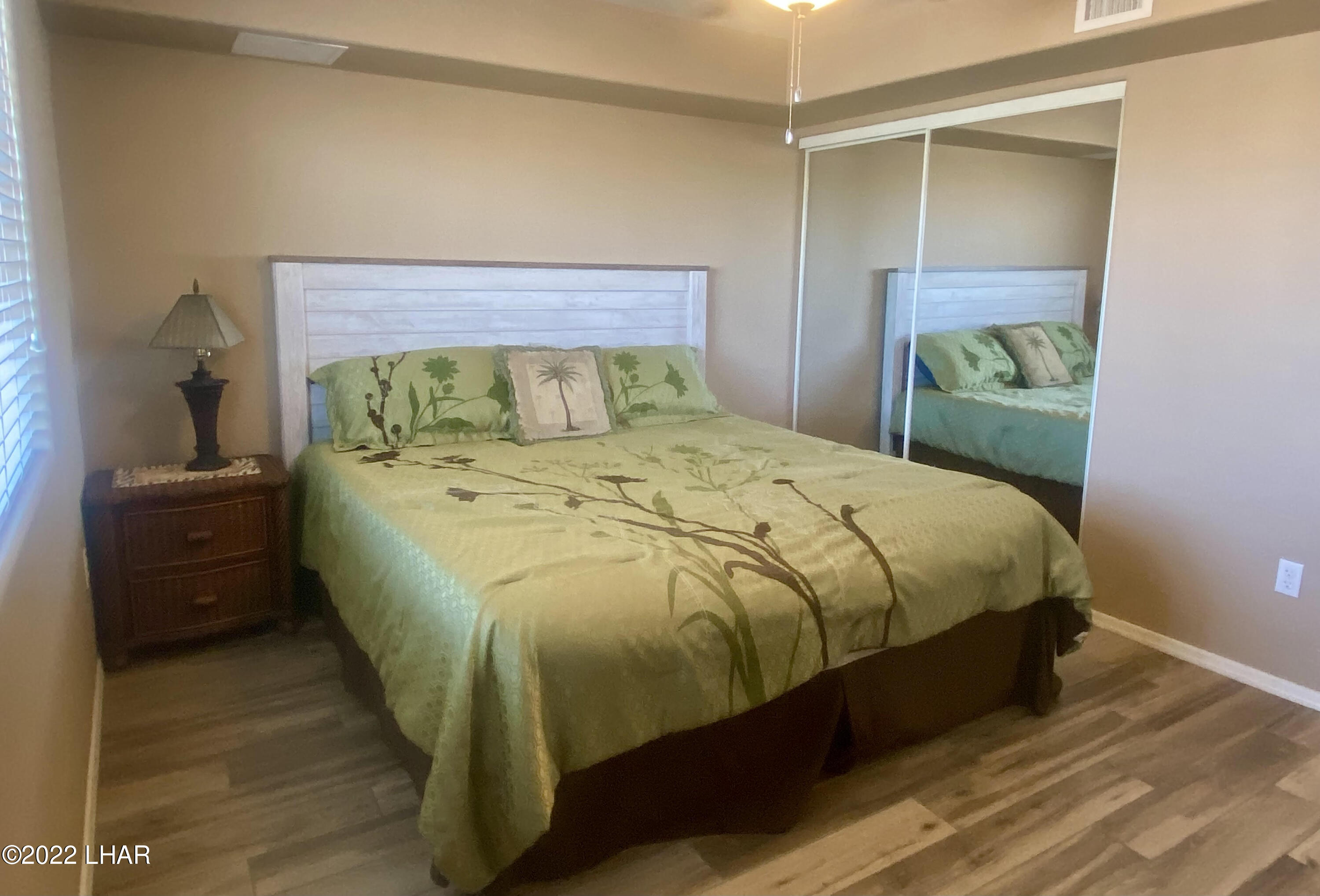 94 London Bridge Road, Unit 507 Lake Havasu City, AZ 86403 - Photo 13 of 13 a bed sitting in a bedroom next to a window