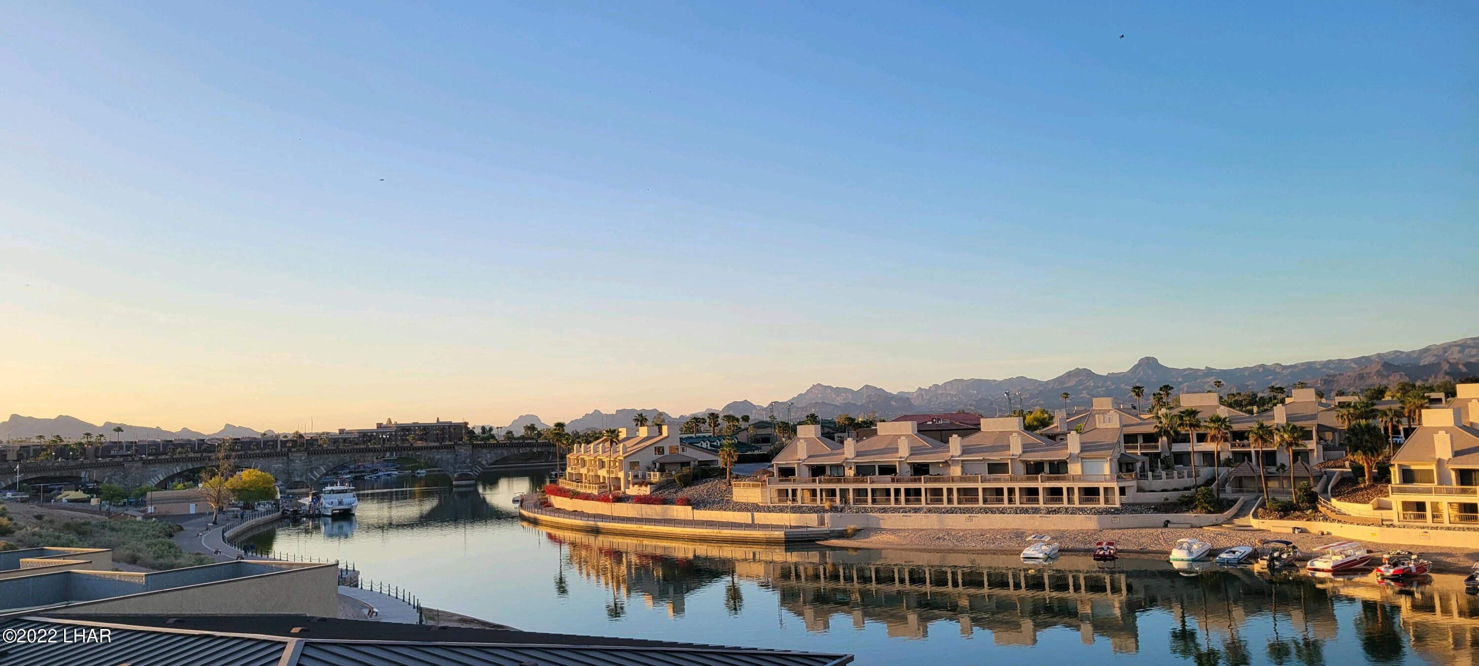 94 London Bridge Road, Unit 507 Lake Havasu City, AZ 86403 - Photo 2 of 13 a view of a lake with a city