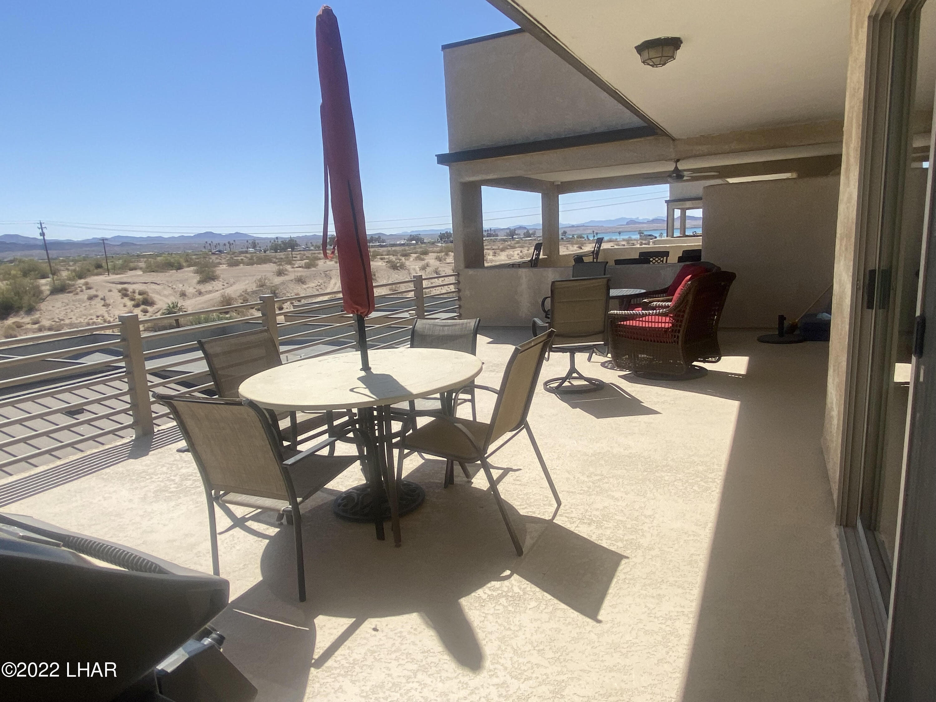 94 London Bridge Road, Unit 507 Lake Havasu City, AZ 86403 - Photo 10 of 13 a dining room with furniture and a floor to ceiling window
