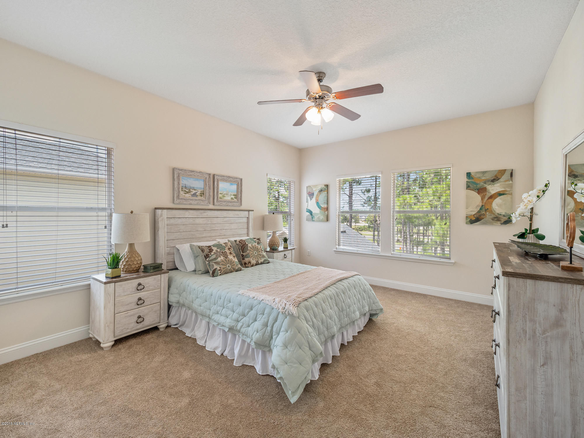 3716 Chasing Falls Road Orange Park, FL 32065 - Photo 13 of 31 a bedroom with a bed and a chandelier