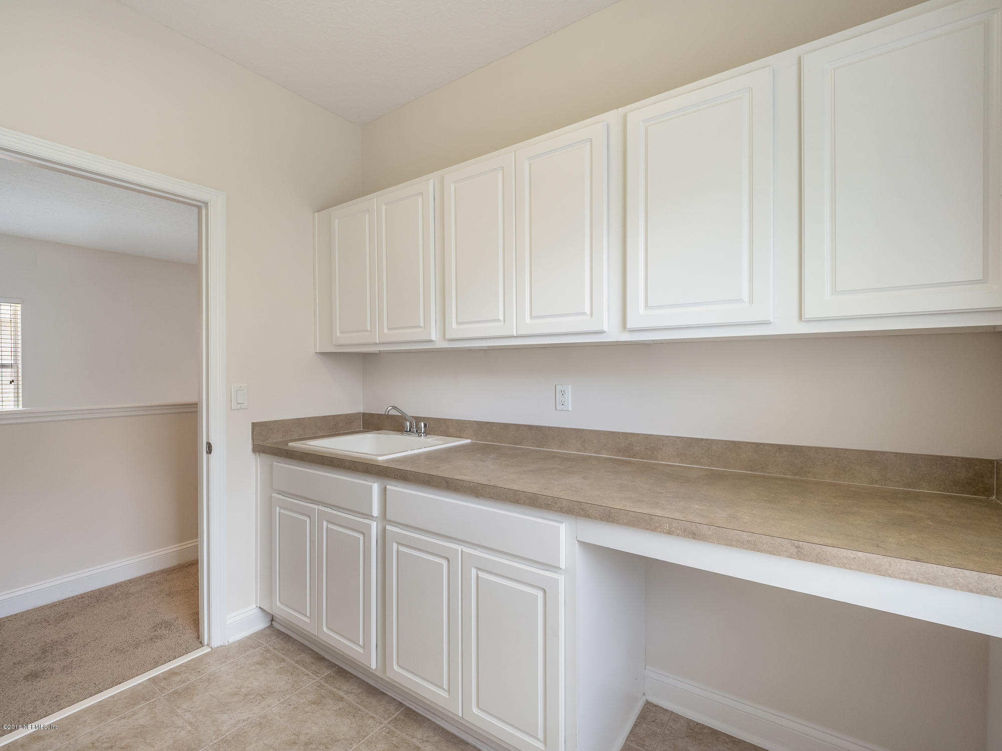 3716 Chasing Falls Road Orange Park, FL 32065 - Photo 24 of 31 a kitchen with granite countertop white cabinets and a sink