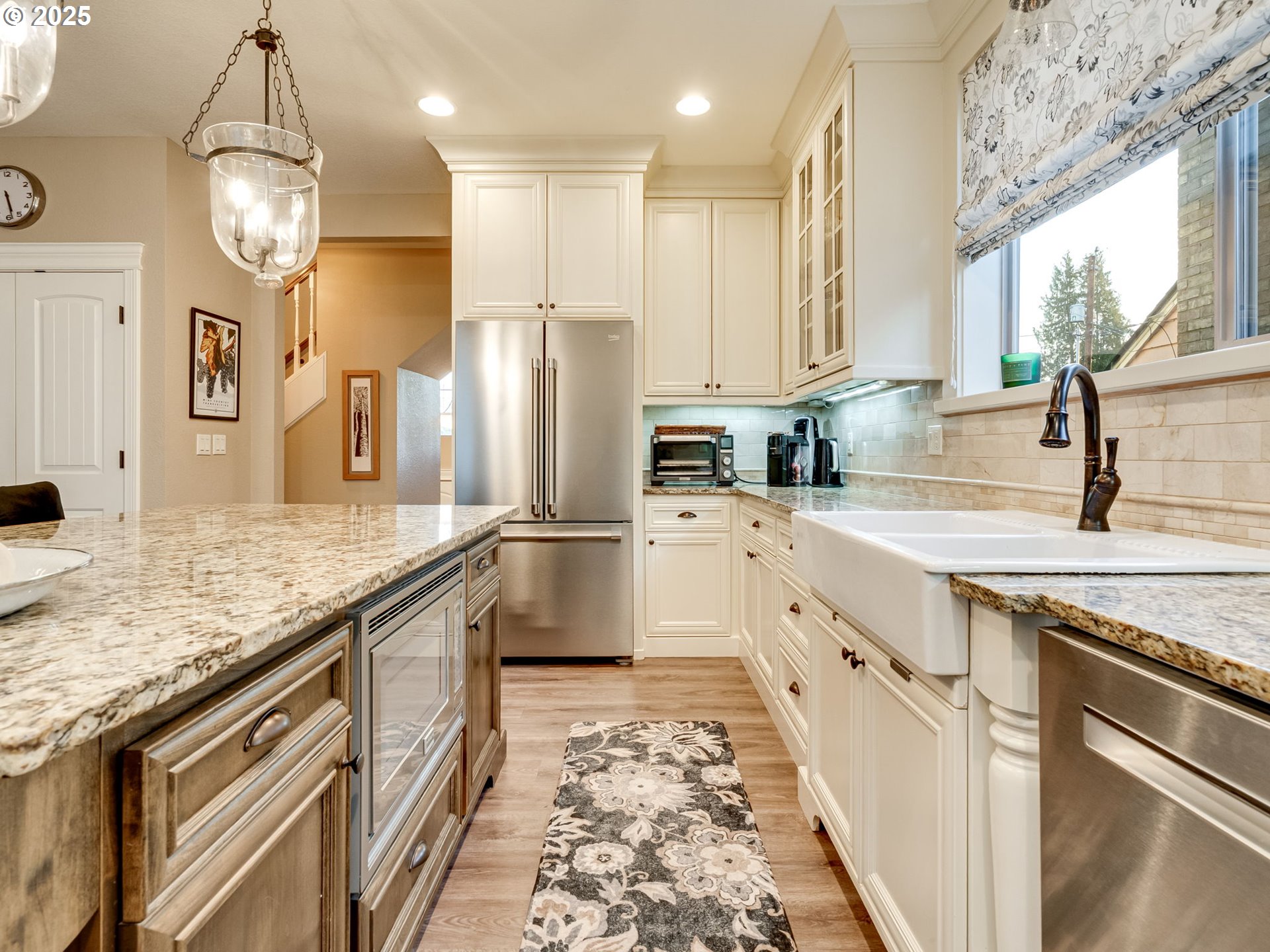 8581 Southeast 19th Avenue Portland, OR 97202 - Photo 11 of 39 a kitchen with stainless steel appliances granite countertop a sink refrigerator and cabinets