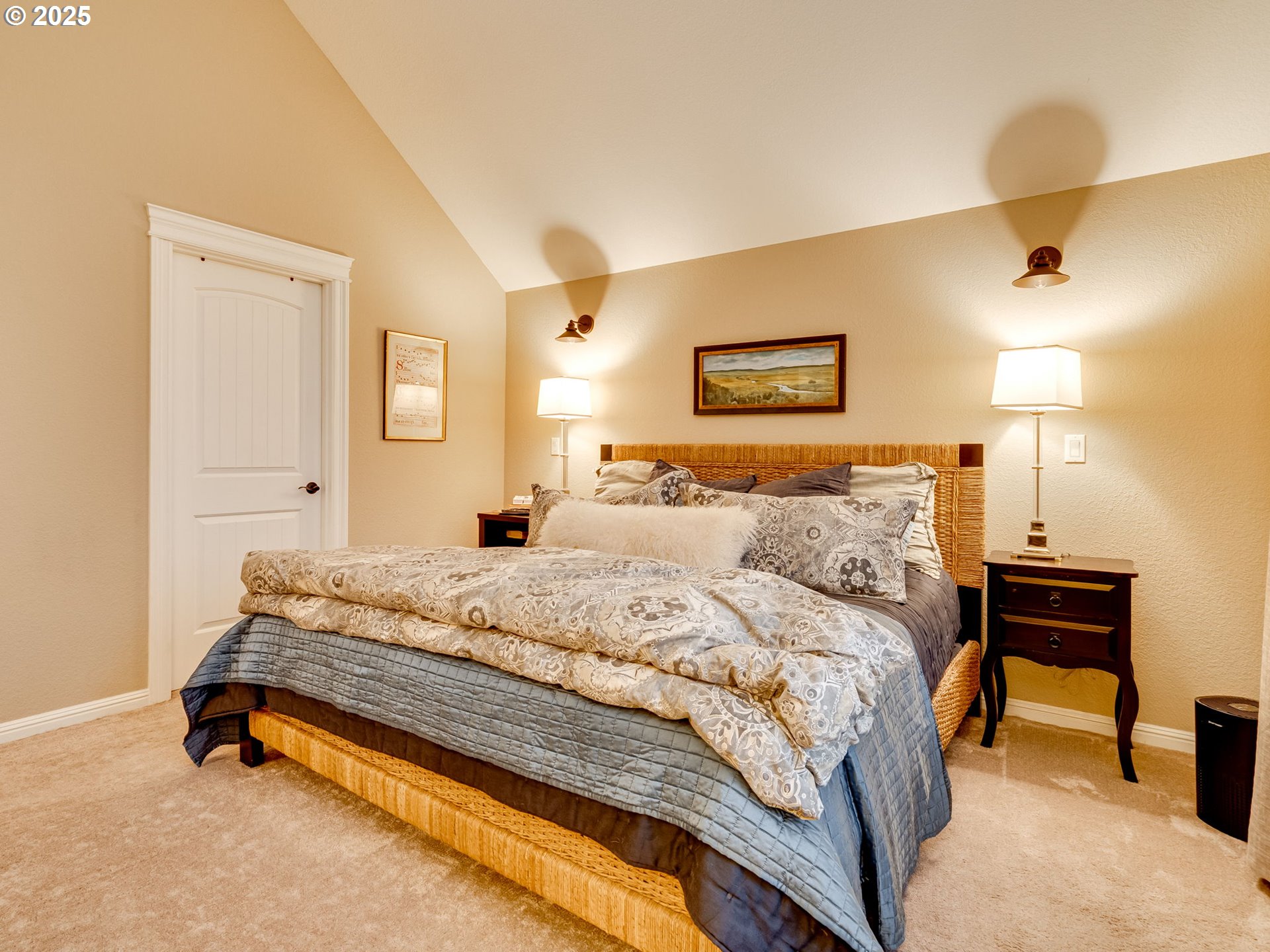 8581 Southeast 19th Avenue Portland, OR 97202 - Photo 21 of 39 a spacious bedroom with a bed and a lamp on table