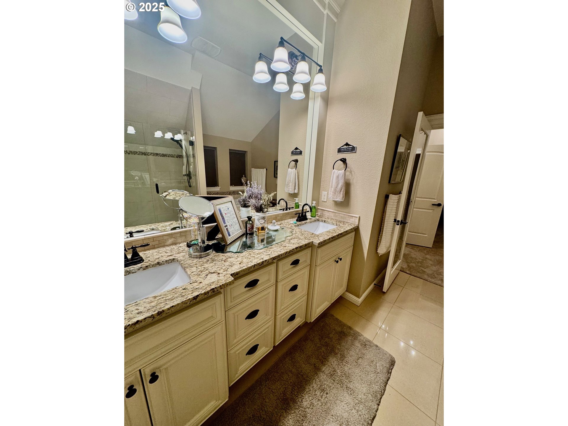8581 Southeast 19th Avenue Portland, OR 97202 - Photo 23 of 39 a bathroom with a double vanity sink and a mirror