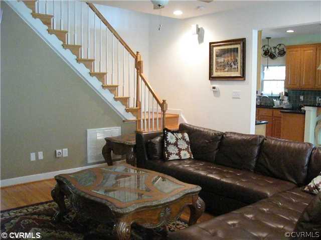 3619 Bailey Farm Road Moseley, VA 23120 - Photo 5 of 12 a living room with furniture and a chandelier