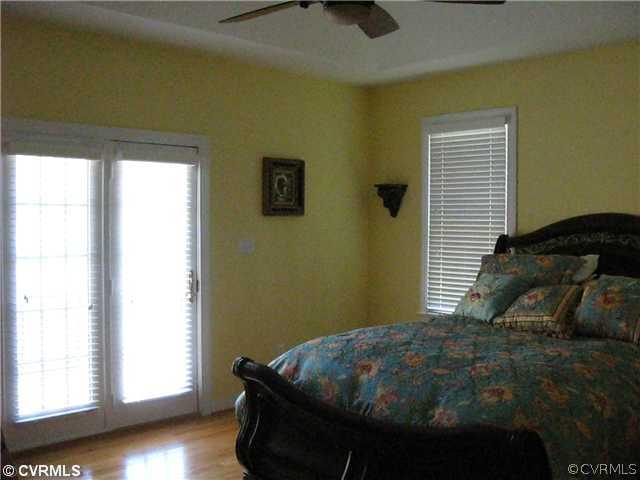 3619 Bailey Farm Road Moseley, VA 23120 - Photo 7 of 12 a bedroom with a bed and a window