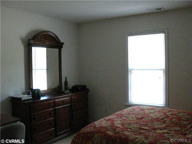3619 Bailey Farm Road Moseley, VA 23120 - Photo 8 of 12 a bedroom with a bed and a window