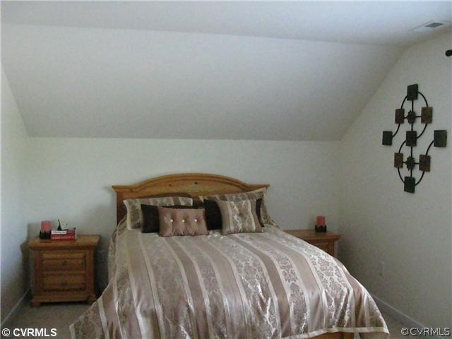 3619 Bailey Farm Road Moseley, VA 23120 - Photo 9 of 12 a bedroom with a bed and a couch