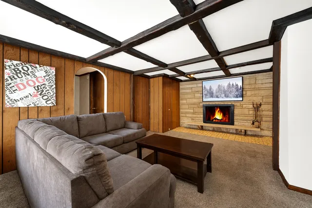 a view of an empty room with a fireplace