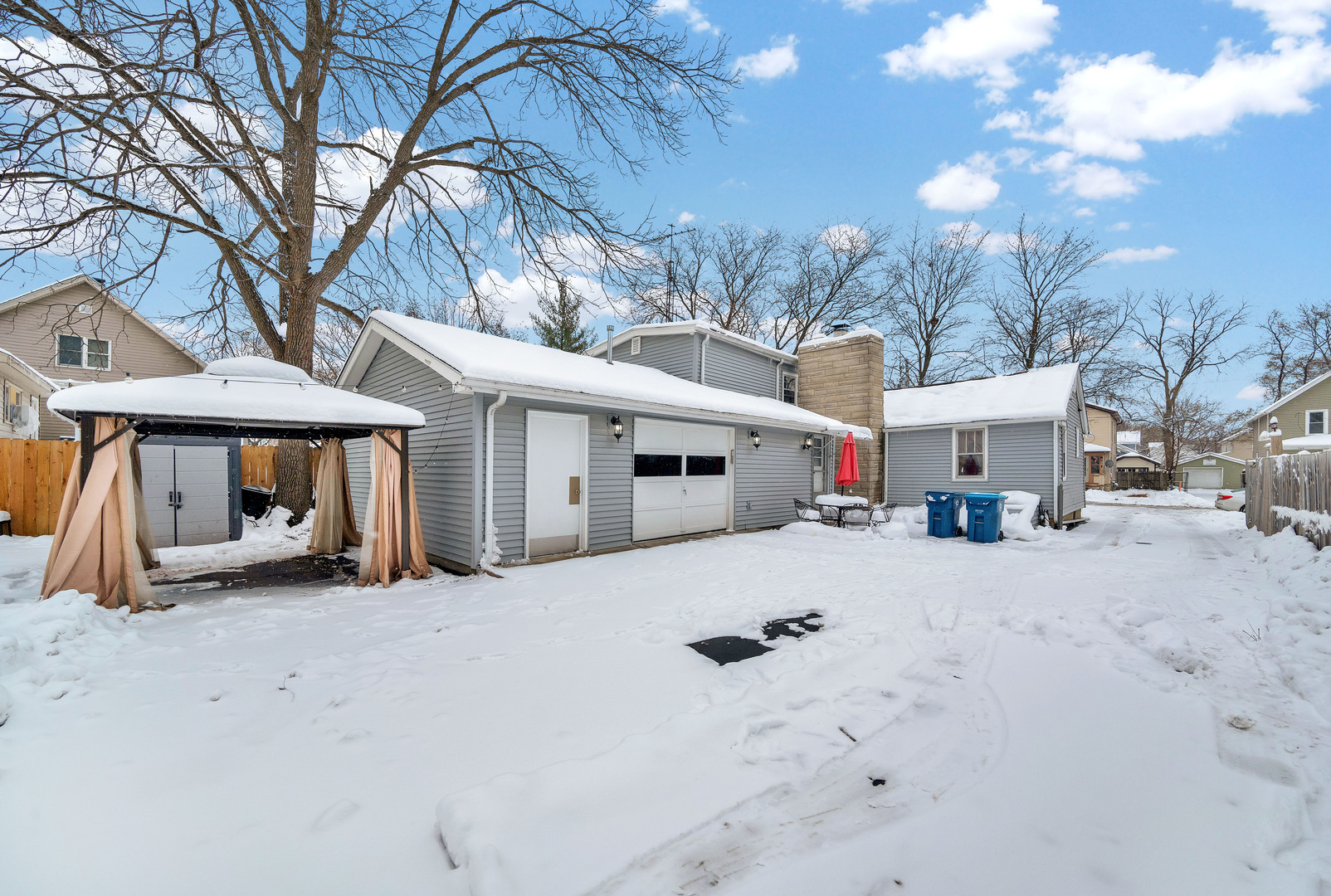 541 Charles Street Aurora, IL 60506 - Photo 31 of 38 a view of a house with a snow in front of house