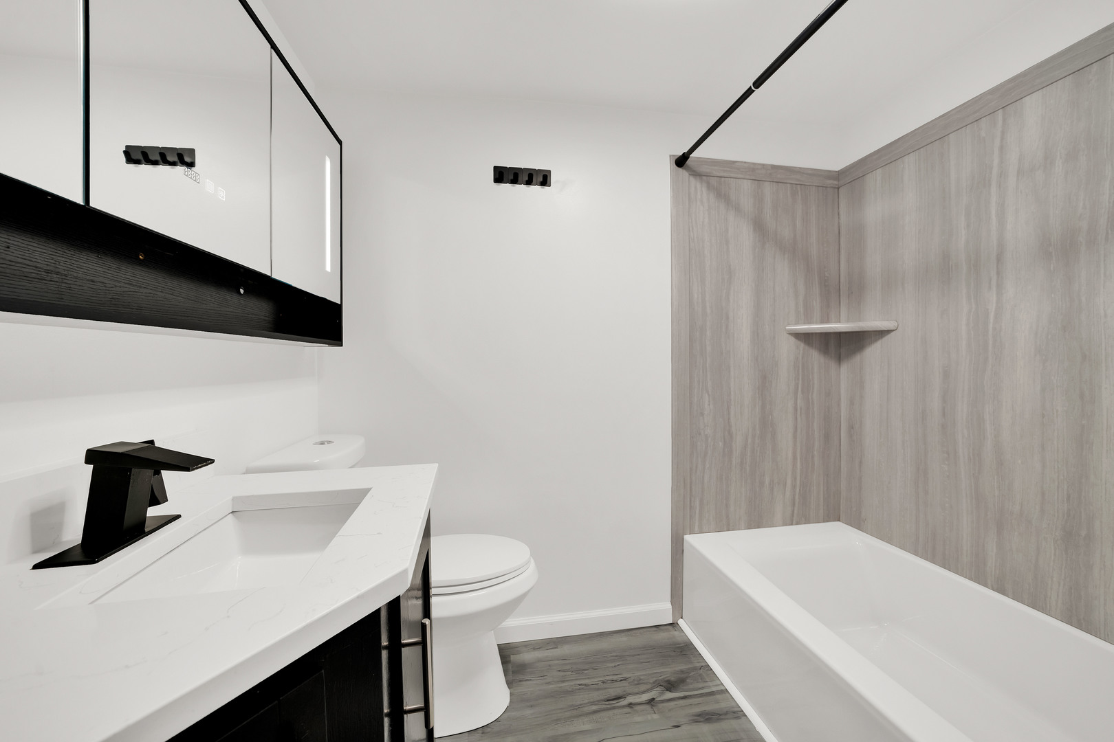 541 Charles Street Aurora, IL 60506 - Photo 8 of 38 a bathroom with a sink a toilet and shower